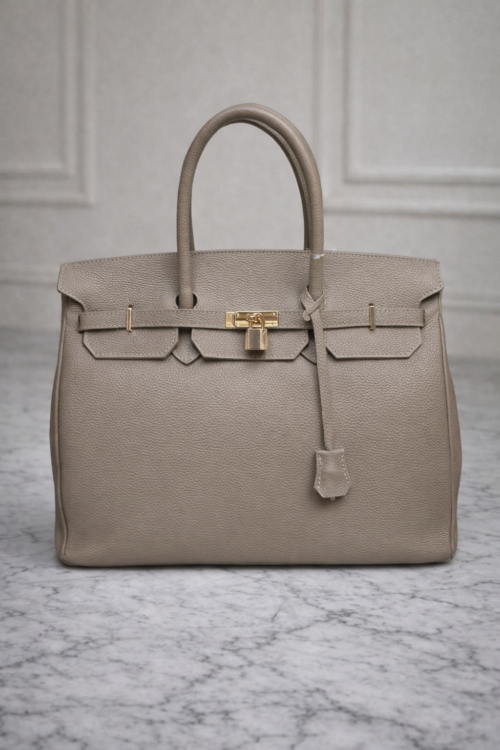 Elegant Leather Handbag with the key Beige